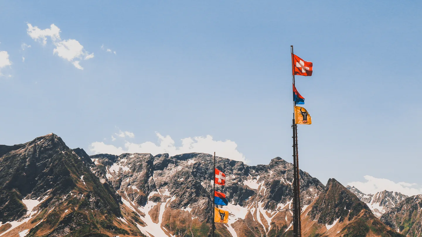Prayer flags in snowy Himalayan terrain for Kailash route comparison