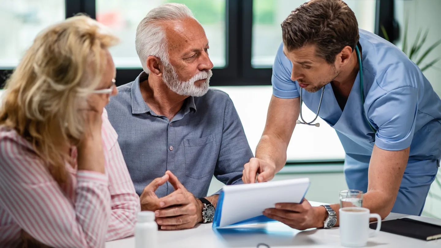 Doctor reviewing medical documents before high altitude pilgrimage