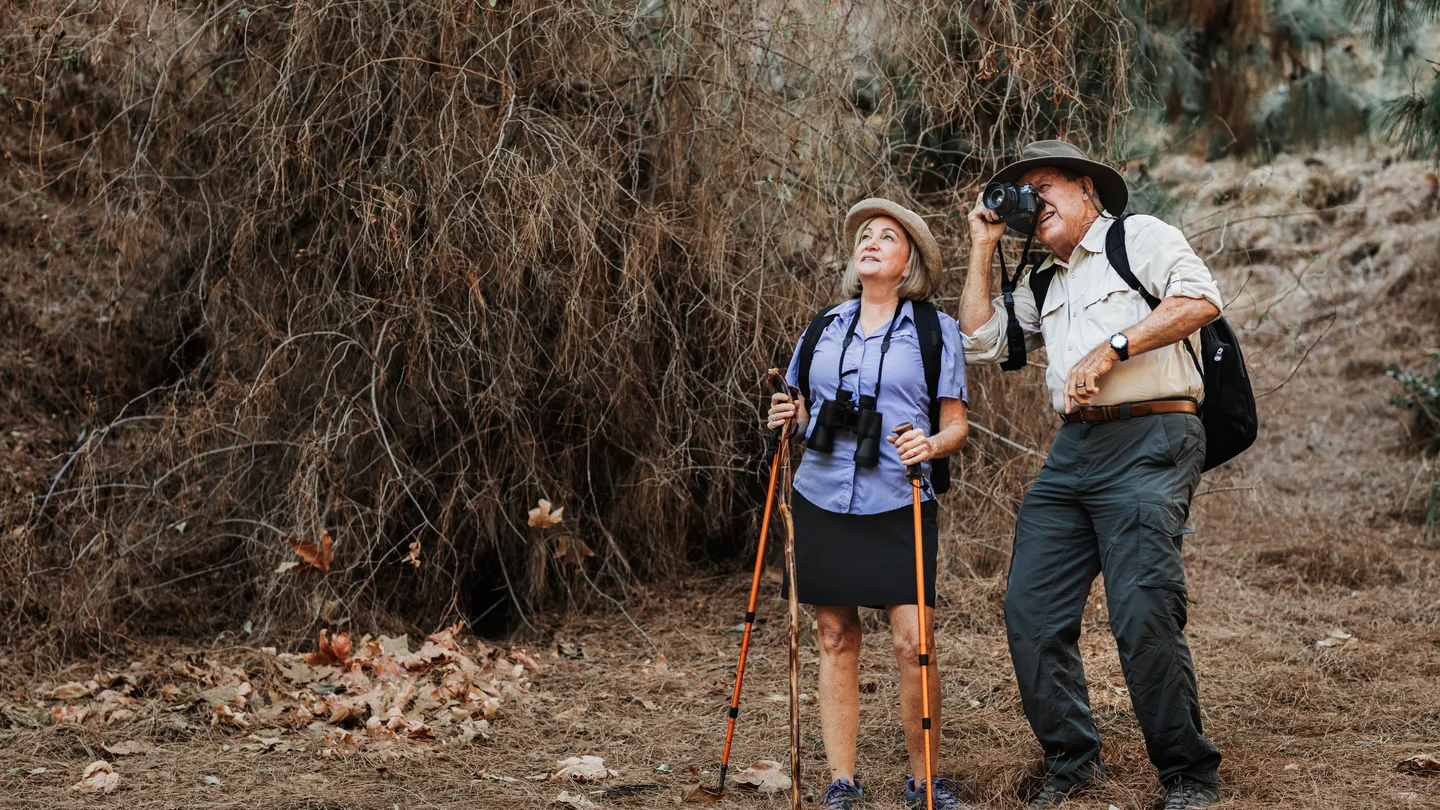Senior traveler in nature representing careful family pilgrimage planning