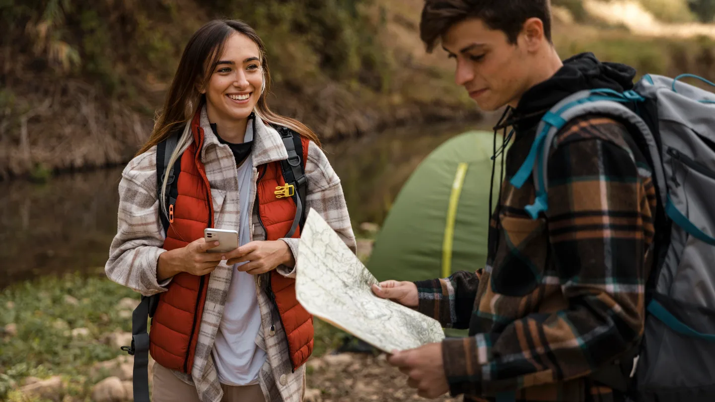 Travelers using a map while planning a relaxed private journey