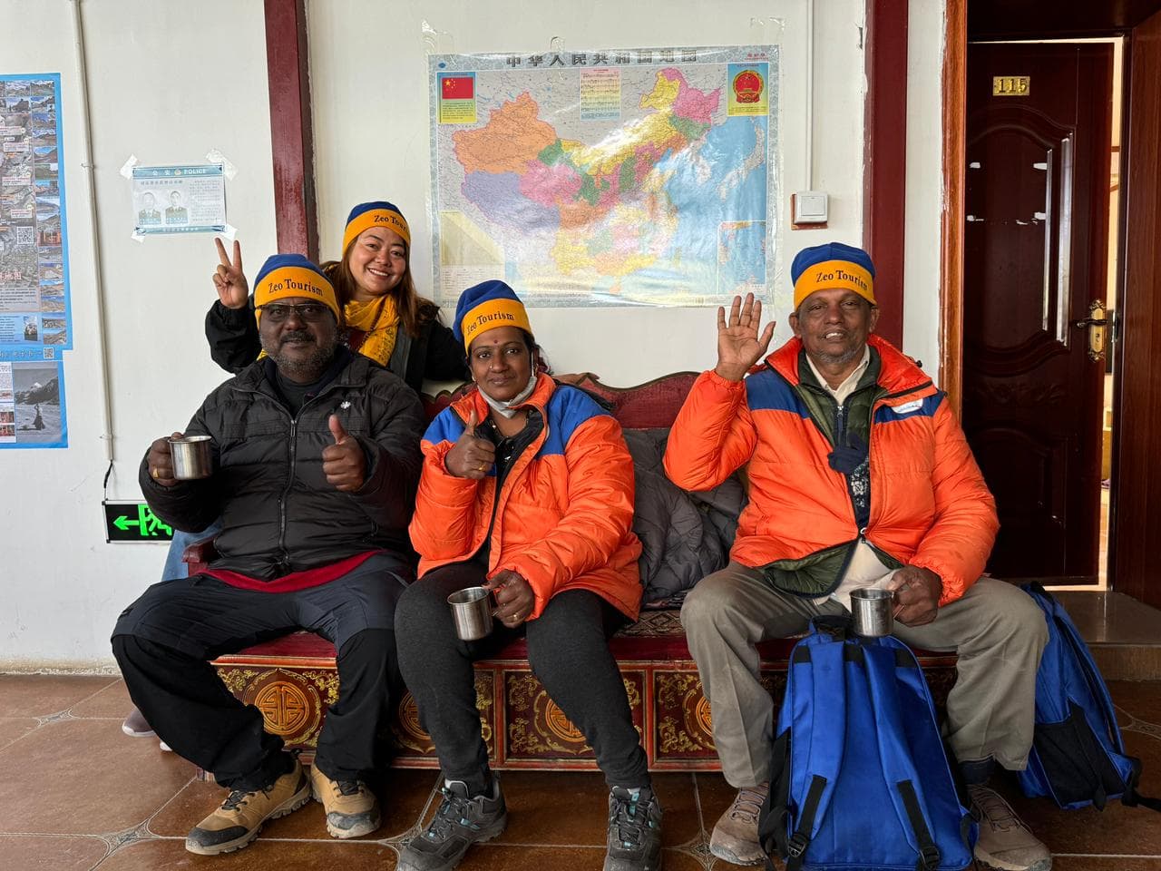 Zeo Tourism Kailash group resting indoors during the journey